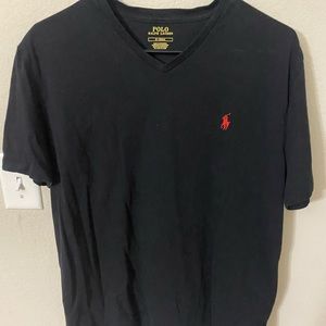 this polo shirt is black with a red polo sign the size is a medium in men.